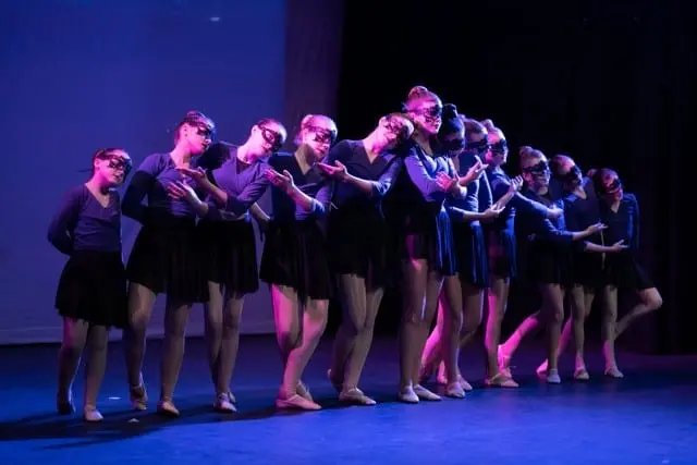 Dancemania Kidlington dancers performing a routine on stage