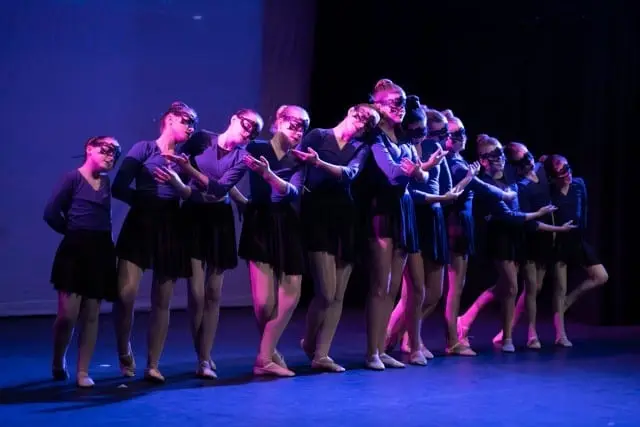 Dancemania Kidlington dancers performing a routine on stage