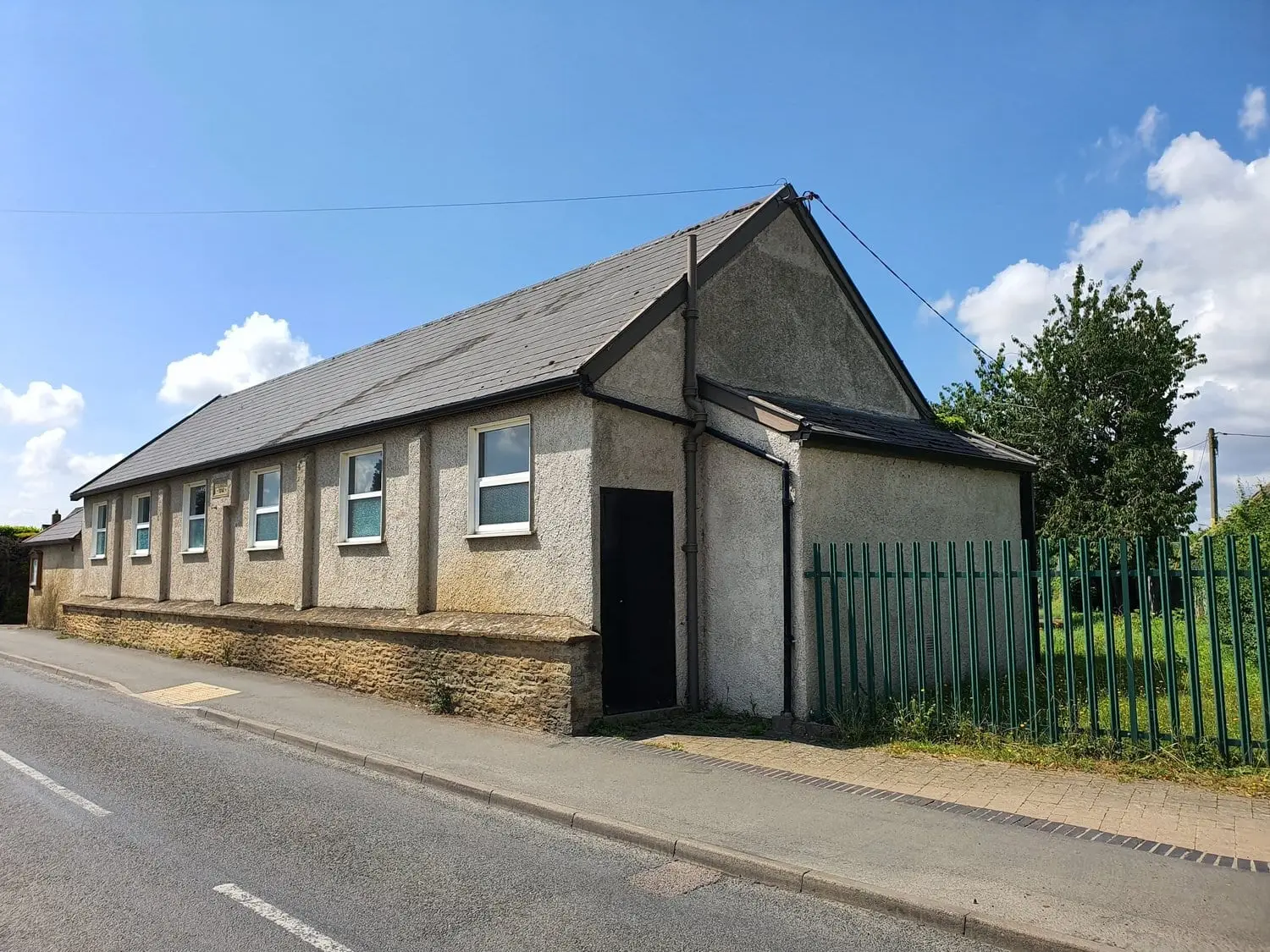 St Kenelm's Hall, a pebbledash village hall on Brize Norton Road, Minster Lovell